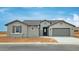 Charming single-story home featuring a neutral color palette, well-manicured yard, and an attached two-car garage at 4227 W Adobe Dr, Eloy, AZ 85131
