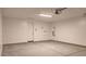 Spacious garage with white walls and concrete flooring offers ample storage and parking at 4227 W Adobe Dr, Eloy, AZ 85131