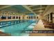 Bright indoor pool area with lap lanes, natural light, and comfortable lounge seating at 4227 W Adobe Dr, Eloy, AZ 85131
