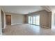 Open living area with tile floors, neutral walls, recessed lights and access to backyard through sliding glass doors at 4227 W Adobe Dr, Eloy, AZ 85131