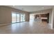 Open living area with tile floors, neutral walls, recessed lights and access to backyard through sliding glass doors at 4227 W Adobe Dr, Eloy, AZ 85131