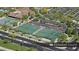Aerial view of sixteen well-maintained pickleball courts, surrounded by lush landscaping and parking at 4227 W Adobe Dr, Eloy, AZ 85131