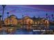 Beautifully lit sports club exterior with lush landscaping and architectural details at twilight at 4227 W Adobe Dr, Eloy, AZ 85131