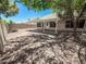 Backyard featuring a covered patio with a gravel area and block wall at 4332 E Stanford Ave, Gilbert, AZ 85234