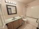 Bright bathroom featuring a tub-shower combo, light green countertop, and updated fixtures at 4332 E Stanford Ave, Gilbert, AZ 85234