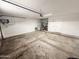 Spacious garage featuring a concrete floor with work table at 4332 E Stanford Ave, Gilbert, AZ 85234