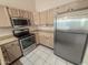 Efficient kitchen with stainless steel appliances and ample cabinet space at 4332 E Stanford Ave, Gilbert, AZ 85234