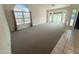 Inviting living room with plush carpeting and large windows, offering great views at 4332 E Stanford Ave, Gilbert, AZ 85234
