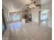 Open-concept living room and kitchen with tile floors and ample natural light at 4332 E Stanford Ave, Gilbert, AZ 85234