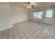 Spacious living room featuring tile flooring and a white door at 4332 E Stanford Ave, Gilbert, AZ 85234
