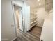 Walk-in closet with built-in shelves, providing ample storage and organization space at 4332 E Stanford Ave, Gilbert, AZ 85234