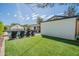 Private backyard featuring a well-manicured lawn, pool, and lounge chairs, ideal for outdoor living and relaxation at 4842 E Fairmount Ave, Phoenix, AZ 85018