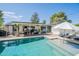 Beautiful backyard oasis with a refreshing swimming pool, outdoor seating, and inviting spaces for relaxation and entertaining at 4842 E Fairmount Ave, Phoenix, AZ 85018