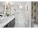 Elegant bathroom featuring a double vanity, a large glass shower, and stylish black-and-white patterned floors at 4842 E Fairmount Ave, Phoenix, AZ 85018