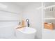 Bright bathroom features white tile, a soaking tub, recessed shelving, and a modern freestanding shelf at 4842 E Fairmount Ave, Phoenix, AZ 85018