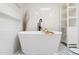 Sleek bathroom with a modern soaking tub, and stylish black-and-white patterned floors at 4842 E Fairmount Ave, Phoenix, AZ 85018