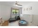 Bright playroom features a window, ceiling fan, play tent, soft rug and storage unit at 4842 E Fairmount Ave, Phoenix, AZ 85018