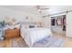 Bright bedroom features closet with barn door, and neutral furnishings at 4842 E Fairmount Ave, Phoenix, AZ 85018