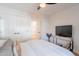 Bedroom with white walls, a modern television, and double door closet at 4842 E Fairmount Ave, Phoenix, AZ 85018