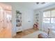 Bedroom with a window and built in bookcases, plus double door closet at 4842 E Fairmount Ave, Phoenix, AZ 85018