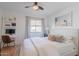 Bedroom featuring a modern bed, neutral walls and furnishings, and a ceiling fan at 4842 E Fairmount Ave, Phoenix, AZ 85018
