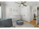 Bright playroom features a window, ceiling fan, play tent, soft rug and storage unit at 4842 E Fairmount Ave, Phoenix, AZ 85018