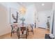 Casual dining area features a round table with seating for four near front entry at 4842 E Fairmount Ave, Phoenix, AZ 85018