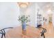 Bright dining room showcases a stylish light fixture and is located close to the kitchen at 4842 E Fairmount Ave, Phoenix, AZ 85018