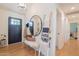 Stylish entryway with hardwood floors, a decorative ladder, and a view into other rooms at 4842 E Fairmount Ave, Phoenix, AZ 85018