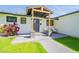 Inviting front porch with seating area and a lush bougainvillea bush at 4842 E Fairmount Ave, Phoenix, AZ 85018