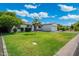 Well-manicured lawn and charming single-story home with a paved driveway at 4842 E Fairmount Ave, Phoenix, AZ 85018