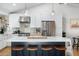 Modern kitchen with a marble island, stainless steel appliances, and stylish bar stool seating at 4842 E Fairmount Ave, Phoenix, AZ 85018