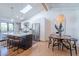 Modern kitchen with a large island, stainless steel appliances, and a skylight for natural light at 4842 E Fairmount Ave, Phoenix, AZ 85018