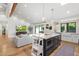 Open kitchen with large island, seating, and stainless steel appliances at 4842 E Fairmount Ave, Phoenix, AZ 85018