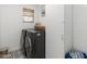 Modern laundry room with side-by-side machines and patterned tile floors at 4842 E Fairmount Ave, Phoenix, AZ 85018