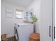 Bright laundry room featuring front loading washer and dryer with a shelf, natural light, and decor at 4842 E Fairmount Ave, Phoenix, AZ 85018