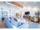 Bright and airy living room with a large sofa, hardwood floors, and accent furniture at 4842 E Fairmount Ave, Phoenix, AZ 85018