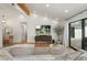 Bright and airy living room with hardwood floors and a large sectional sofa at 4842 E Fairmount Ave, Phoenix, AZ 85018