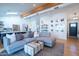 Open-concept living area with a cozy sectional sofa and a view into the kitchen at 4842 E Fairmount Ave, Phoenix, AZ 85018