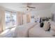 Serene bedroom featuring french doors, light wood floors, and a view of the backyard at 4842 E Fairmount Ave, Phoenix, AZ 85018