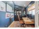 Stylish home office featuring built-in bookshelves, a modern desk, and beautiful natural light at 4842 E Fairmount Ave, Phoenix, AZ 85018