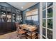 Stylish home office featuring built-in bookshelves, a modern desk, and a comfortable leather chair at 4842 E Fairmount Ave, Phoenix, AZ 85018