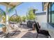 Relaxing outdoor patio featuring a hanging chair, barbecue, and bar seating at 4842 E Fairmount Ave, Phoenix, AZ 85018