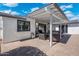 Outdoor patio featuring comfortable seating, a TV, and stylish pavers for relaxing and entertaining at 4842 E Fairmount Ave, Phoenix, AZ 85018
