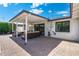 The covered patio features an outdoor seating area and a wall-mounted television at 4842 E Fairmount Ave, Phoenix, AZ 85018