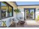 Cozy patio with comfortable seating, brick flooring, and access to indoor spaces at 4842 E Fairmount Ave, Phoenix, AZ 85018