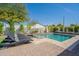 Inviting pool area with lounge chairs, lush greenery, and a relaxing atmosphere, perfect for summer enjoyment at 4842 E Fairmount Ave, Phoenix, AZ 85018
