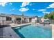 A fenced-in swimming pool with lounge chairs offers a refreshing escape at 4842 E Fairmount Ave, Phoenix, AZ 85018