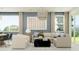 Cozy living room showcasing neutral tones, stylish decor, and ample natural light at 4963 S 233Rd Dr, Buckeye, AZ 85326
