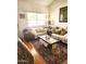 Comfortable living room with plush sofas, patterned rug, and ample natural light at 5136 E Evergreen St # 1053, Mesa, AZ 85205